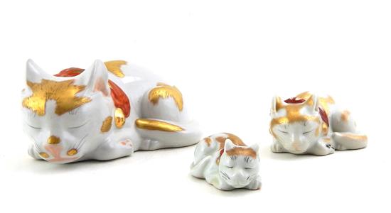 Appraisal: ASIAN Three th C Kutani porcelain sleeping cat figures in