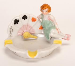 Appraisal: Trump Indicator Girl Circa Porcelain ash tray made either in