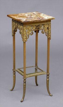 Appraisal: AESTHETIC GILT-BRONZE SIDE TABLE The onyx top above a base