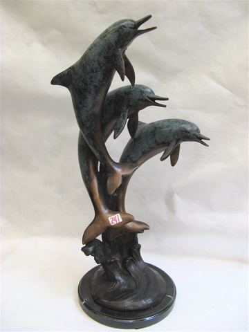 Appraisal: CONTEMPORARY BRONZE SCULPTURE depicting three playful dolphins leaping out of