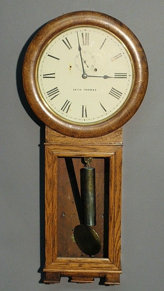 Appraisal: Seth Thomas regulator clock with an oak case and single