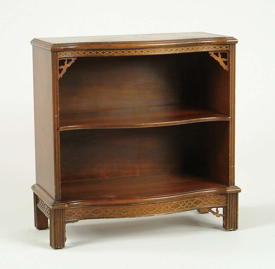 Appraisal: SMALL MAHOGANY BOOKCASE Serpentine front with Chippendale influence One adjustable