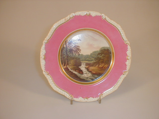 Appraisal: A Rockingham plate painted to the well with a river