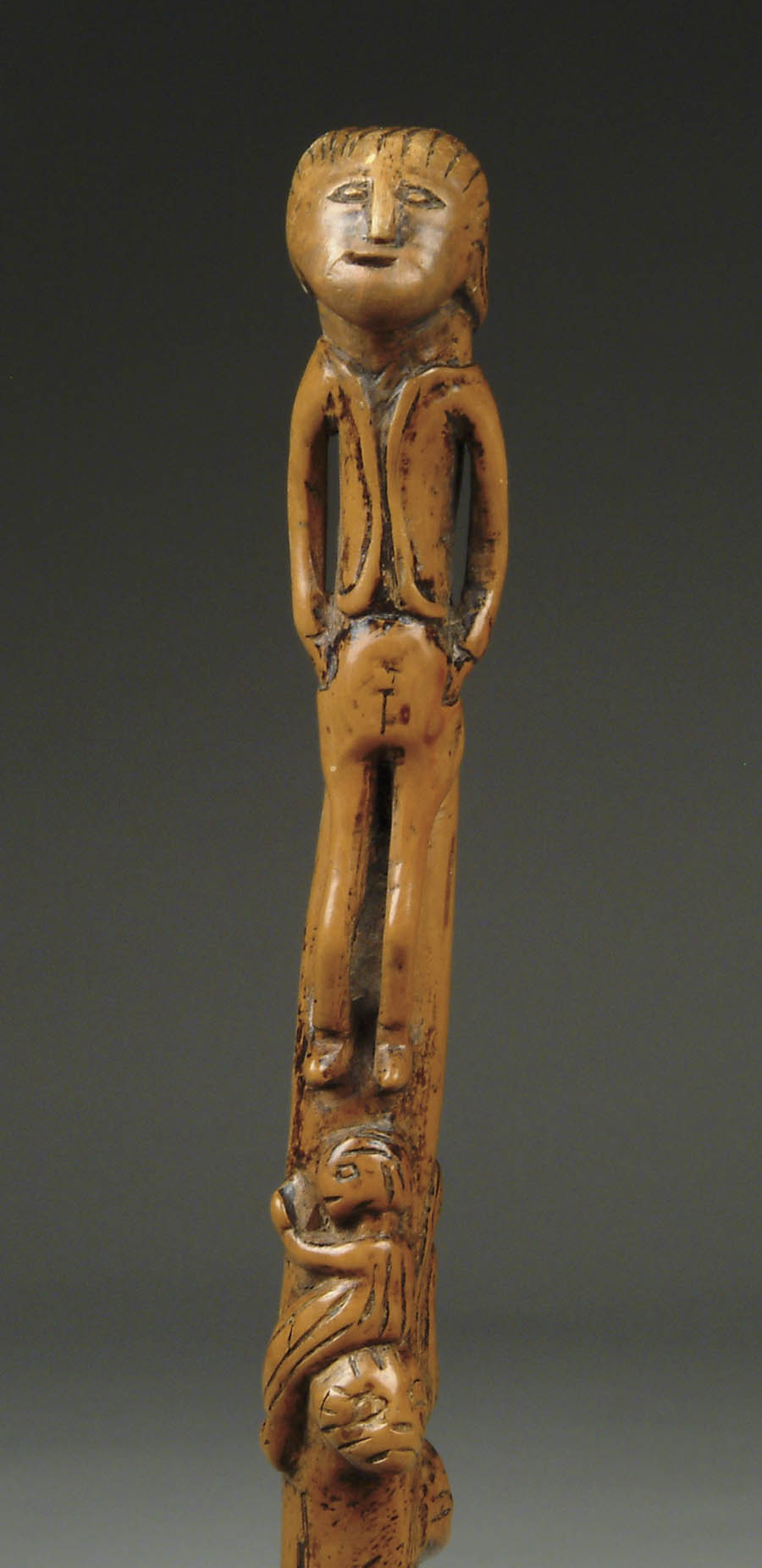 Appraisal: CARVED FOLK ART FIGURAL WOOD CANE All in one piece