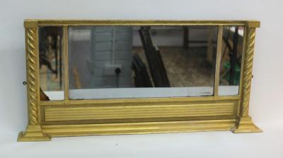 Appraisal: A Regency gilt framed overmantel mirror with fluted frieze above