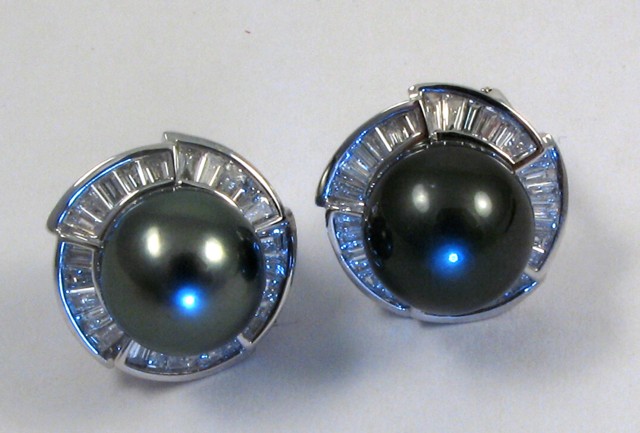 Appraisal: PAIR OF BLACK PEARL EARRINGS each with a single round