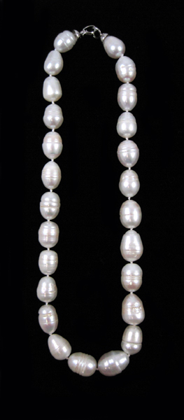 Appraisal: PRINCESS LENGTH WHITE PEARL NECKLACE measuring inches in length and