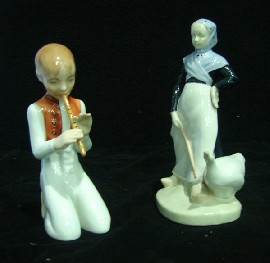 Appraisal: A Herend porcelain figure of a kneeling boy playing a