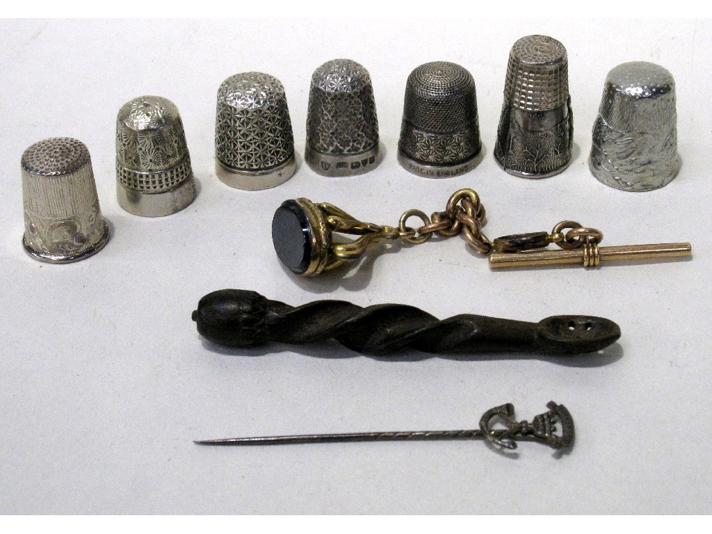 Appraisal: Lot comprising two silver thimbles five others a stickpin watch