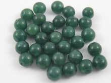 Appraisal: A quantity of loose polished drilled green gemstone beads total