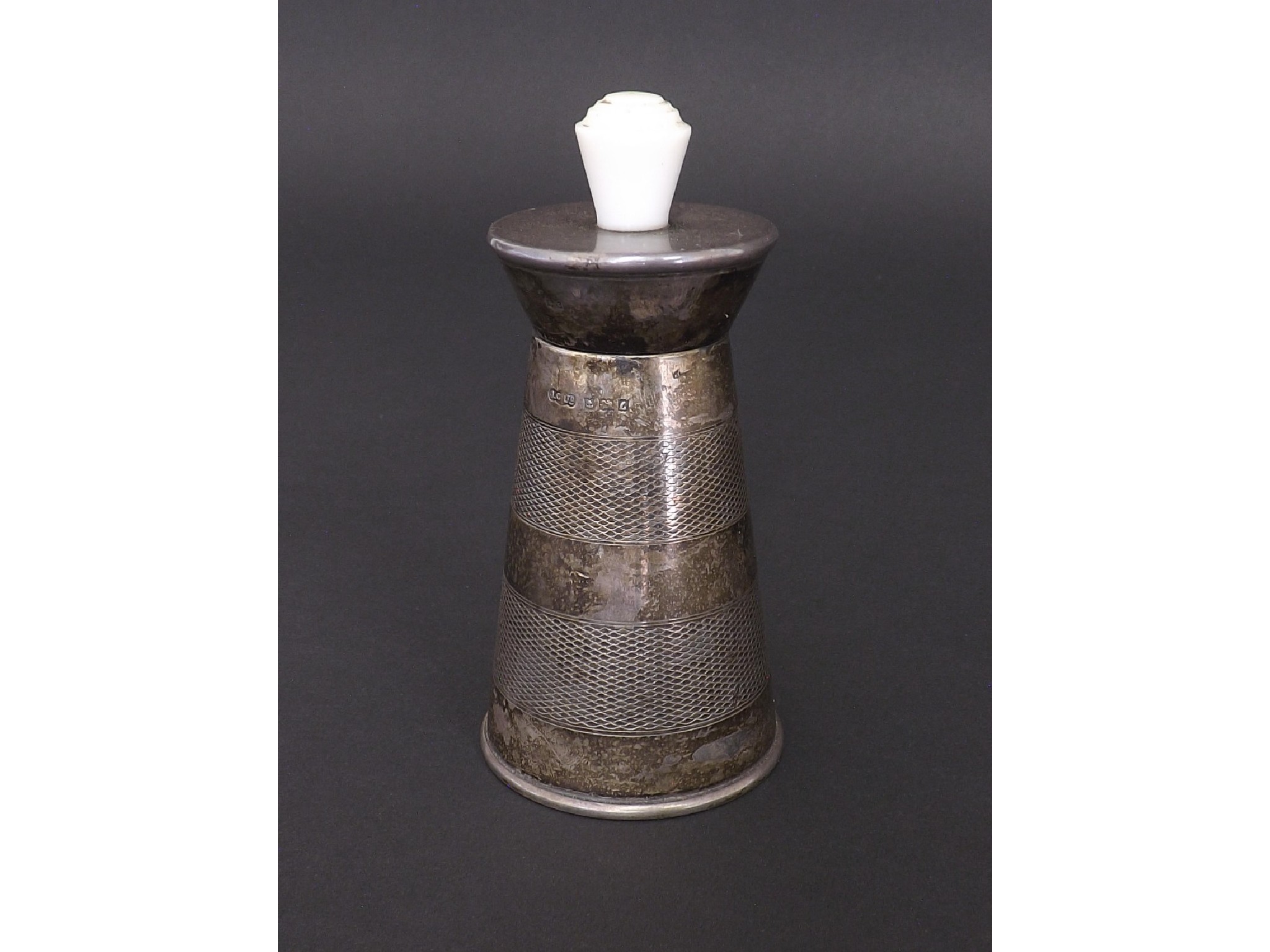 Appraisal: s silver engine turned pepper mill with faux ivory knop