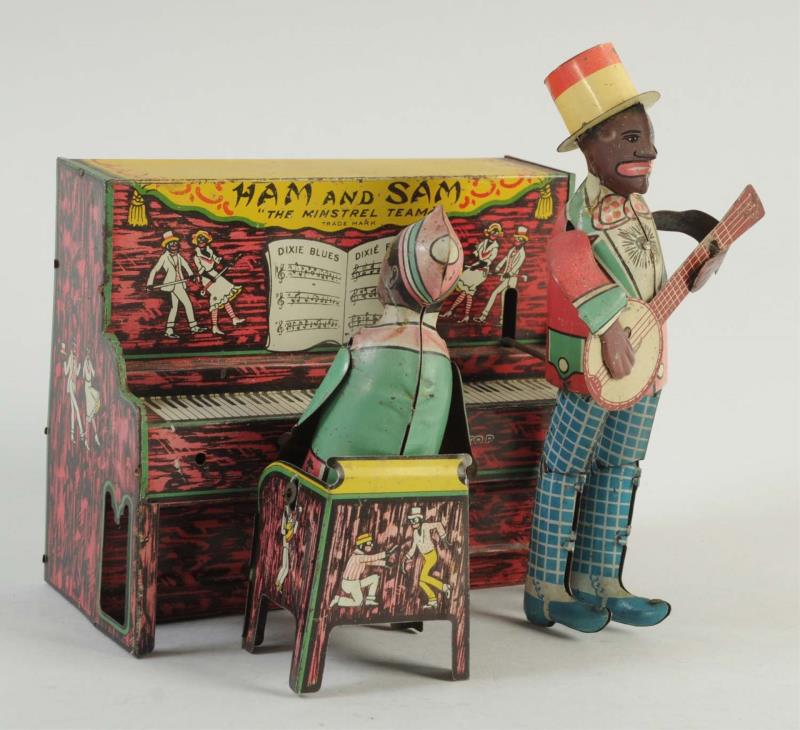 Appraisal: Ferdinand Strauss Co Tin Wind-Up Ham And Sam Includes musician