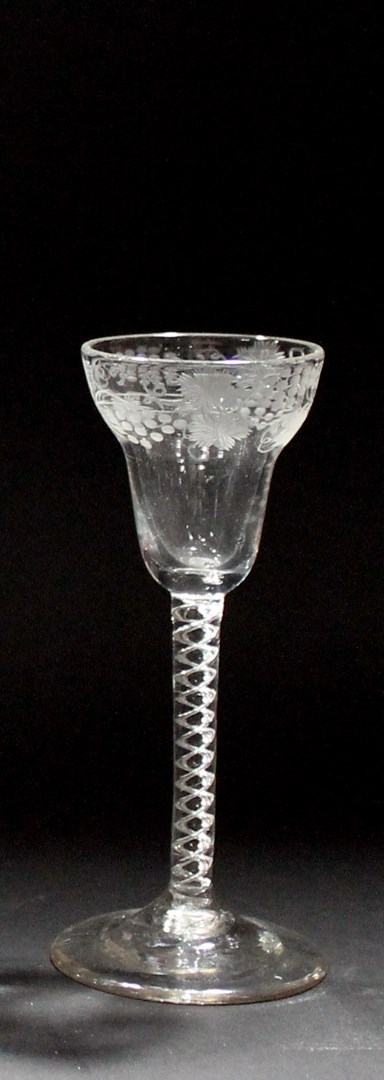 Appraisal: A George II engraved wine glass circa with ogee bowl