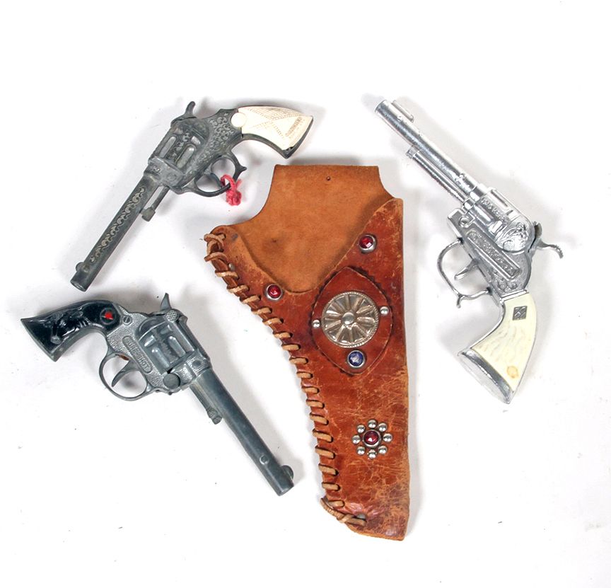 Appraisal: Cap Gun Lot Jeweled holster Ranger single shot Sure shot