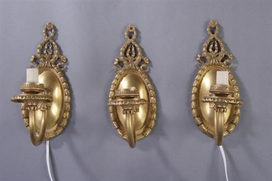 Appraisal: THREE LOUIS XVI-STYLE BRONZE DOR TWO-LIGHT WALL SCONCES early th