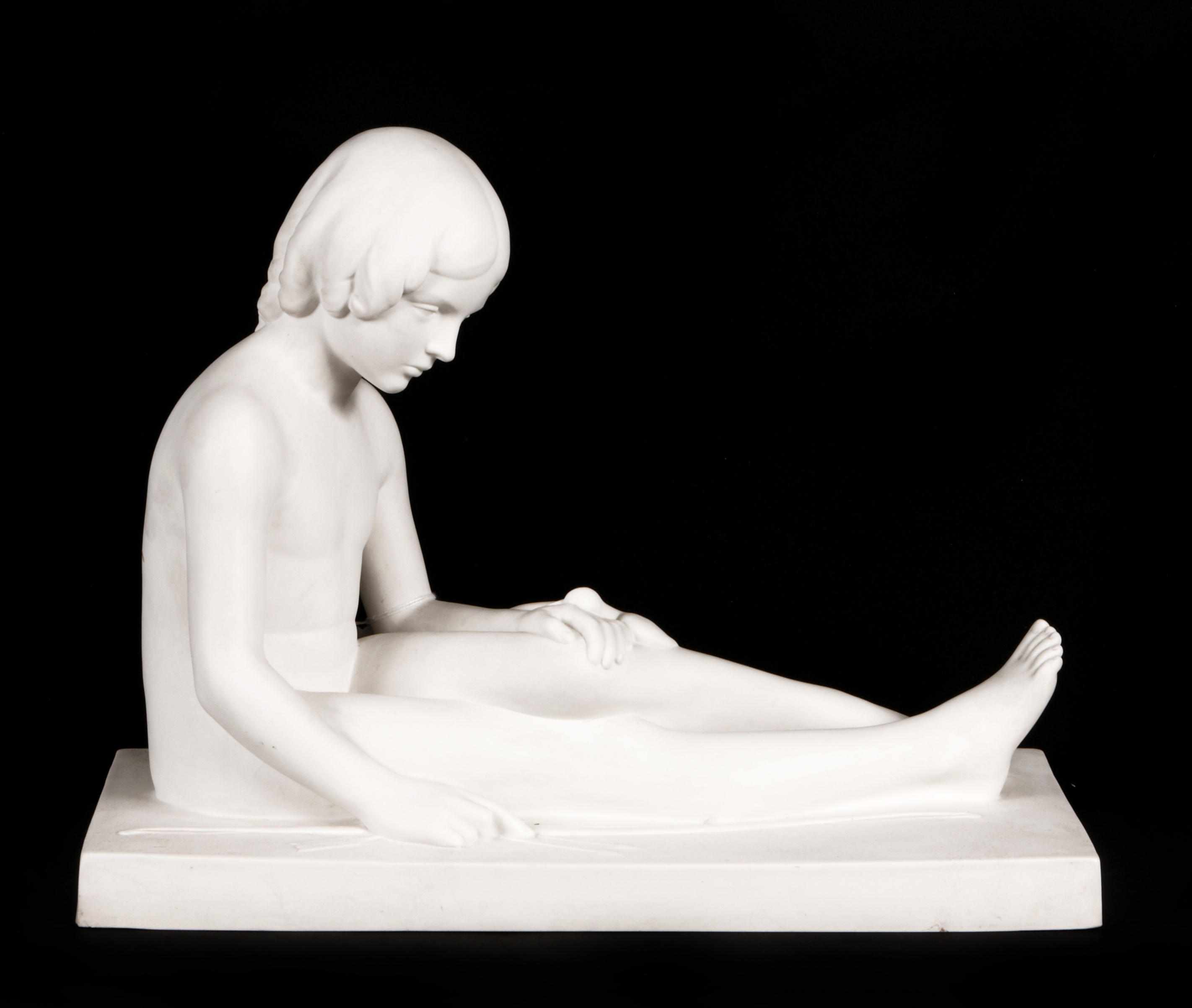 Appraisal: A ceramic sculpture of a young girl and a dove