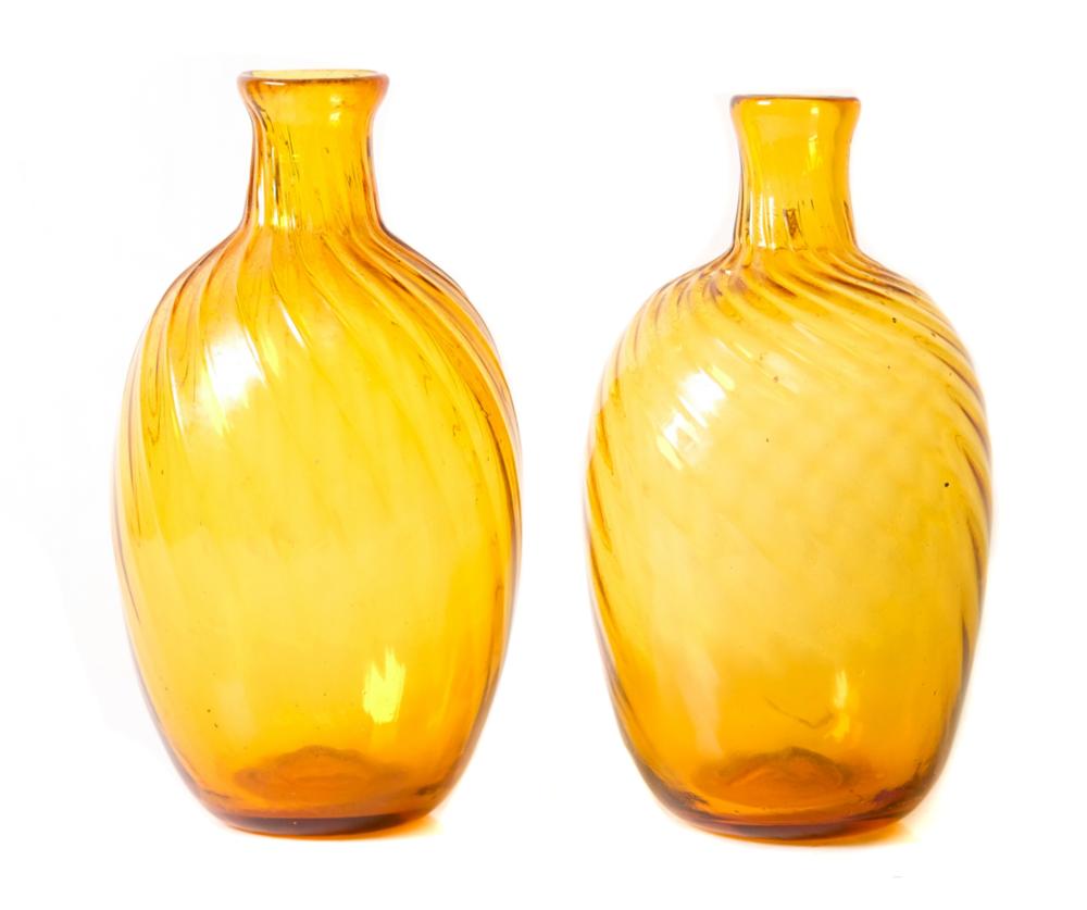 Appraisal: PAIR HAND BLOWN AMBER GLASS SPIRAL RIBBED FLASKSNear pair of