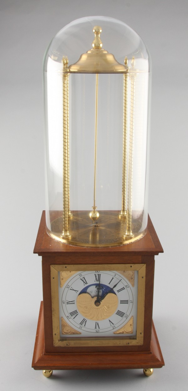 Appraisal: Clock with moon phase glass dome t ball feet sun