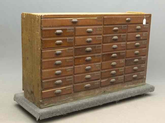 Appraisal: th c drawer hardware store cabinet in old red stain