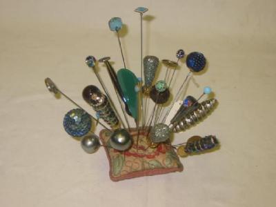 Appraisal: A COLLECTION OF TWENTY NINE HAT PINS in blue and