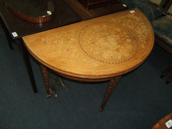 Appraisal: A Dutch walnut and floral marquetry circular fold over card