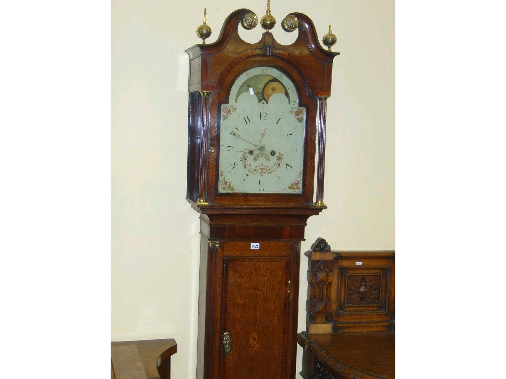 Appraisal: A Georgian oak longcase clock the arched hood with broken