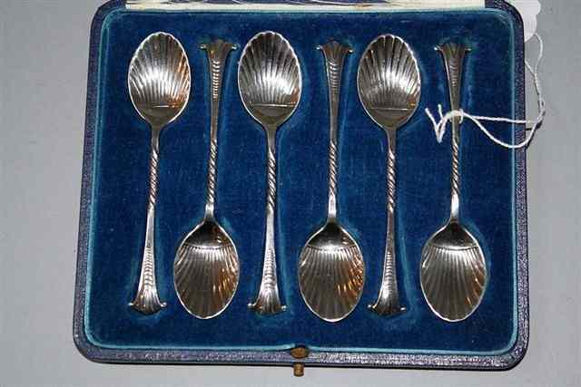 Appraisal: A CASED SET OF SILVER TEASPOONS with shell bowls and