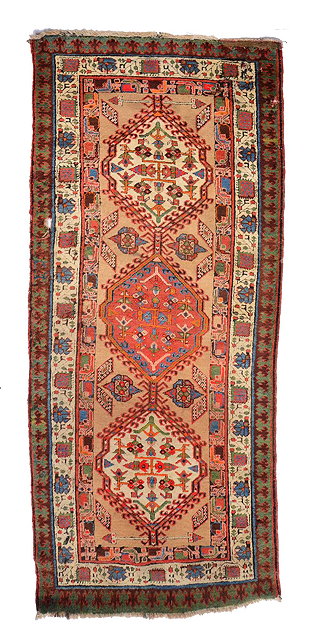 Appraisal: A PERSIAN CAMEL GROUND RUNNER with a central interlocking medallion