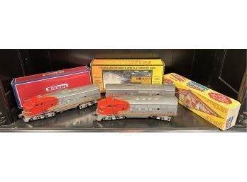 Appraisal: Two Santa Fe Diesel engines with three boxed trains Rail