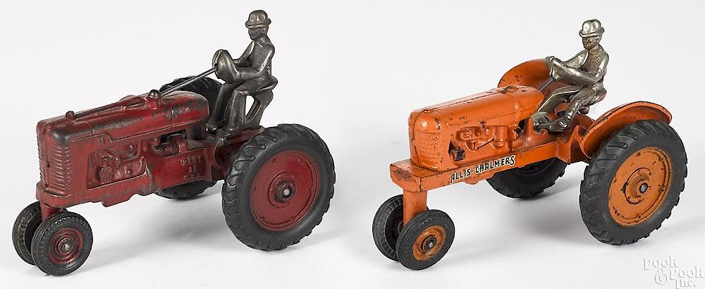 Appraisal: Two Arcade cast iron tractors Two Arcade cast iron farm