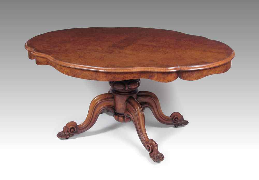 Appraisal: A VICTORIAN BURR WALNUT LOO TABLE Oval shaped tilt top