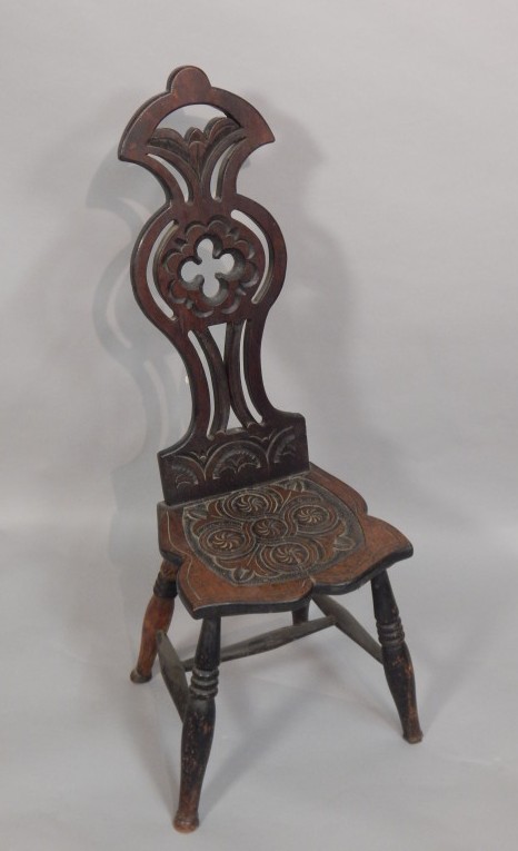 Appraisal: A late Victorian walnut hall chair with pierced and caved