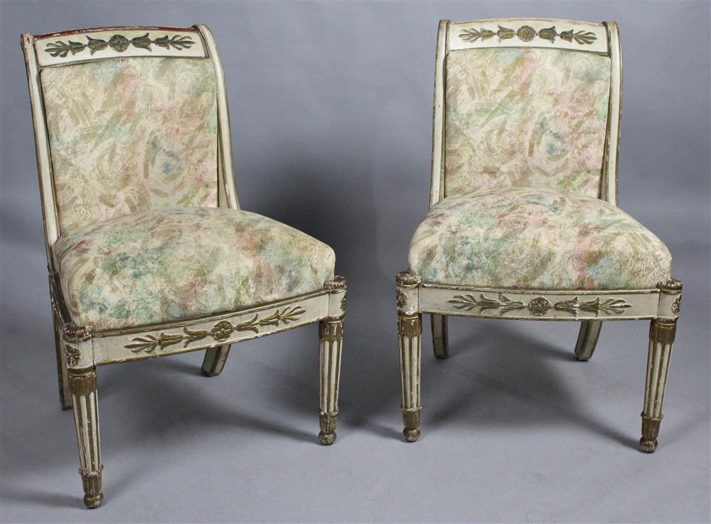 Appraisal: PAIR OF EMPIRE PARCEL GILT CREAM PAINTED CHAISES early th