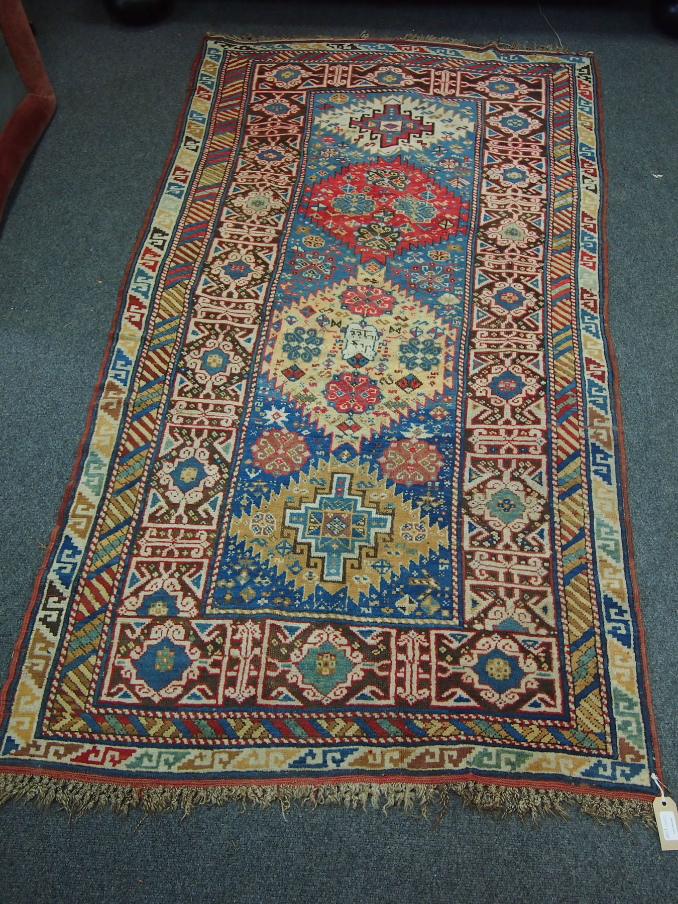 Appraisal: A Caucasian rug with four multi coloured medallions one dated