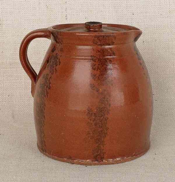 Appraisal: Pennsylvania redware batter pitcher th c with manganese decoration h