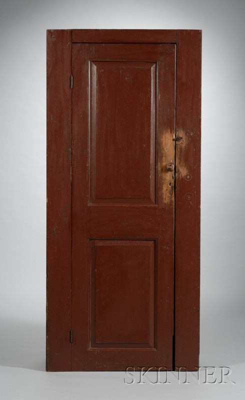 Appraisal: Red-painted Wooden Paneled Door Cupboard the interior with four fixed