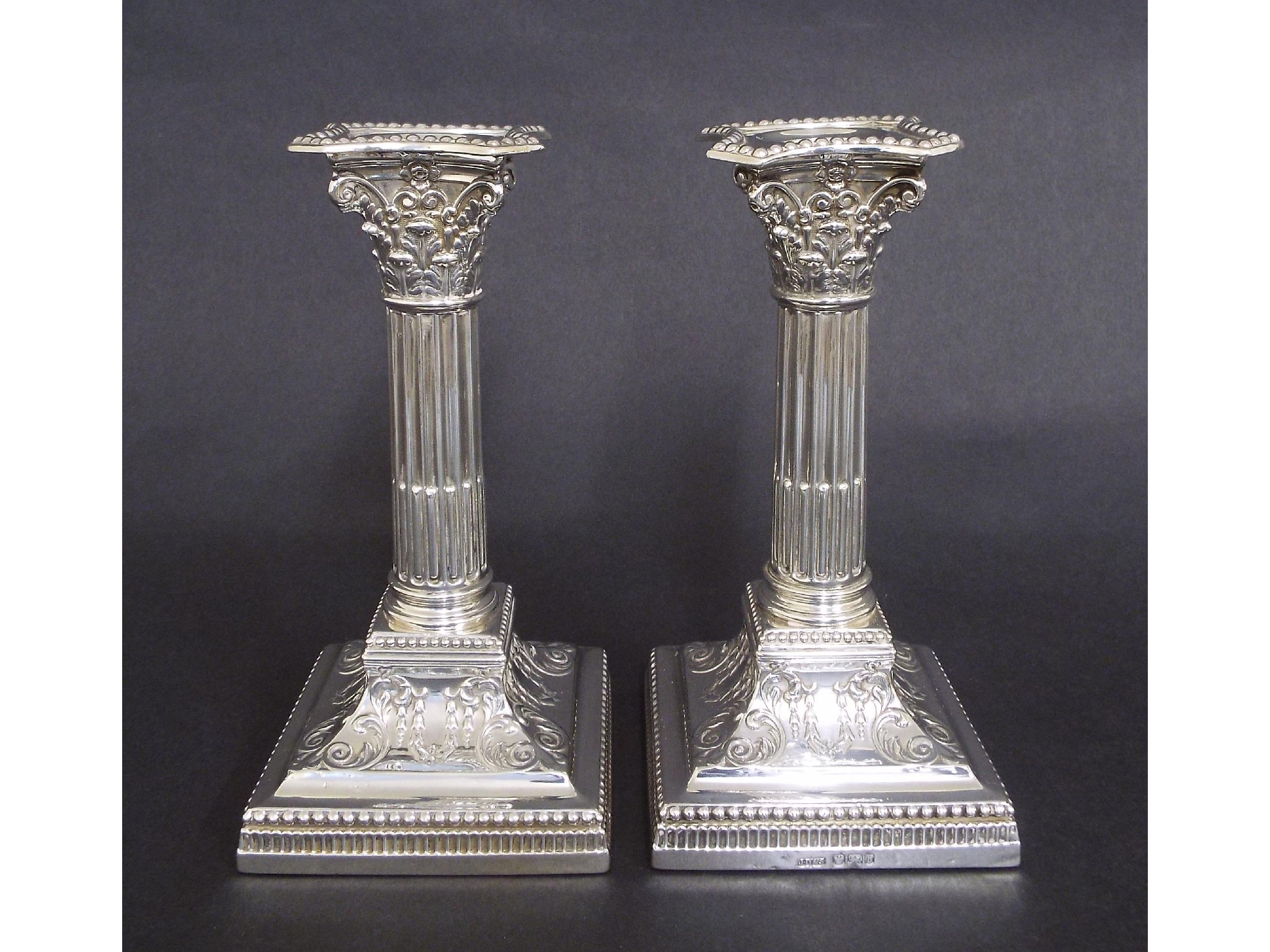 Appraisal: Pair of late Victorian silver Corinthian column candlesticks maker James