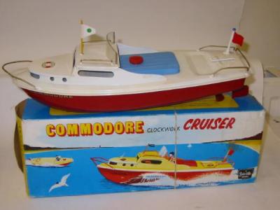 Appraisal: A Commodore Cruiser clockwork white deck red hull boxed E