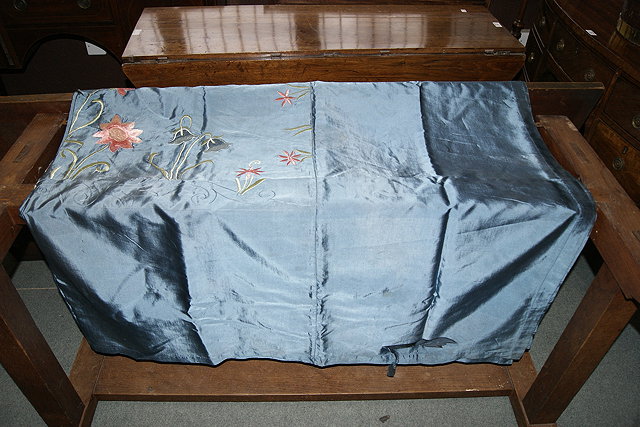 Appraisal: A SILK BLUE GROUND THROW with embroidered decoration