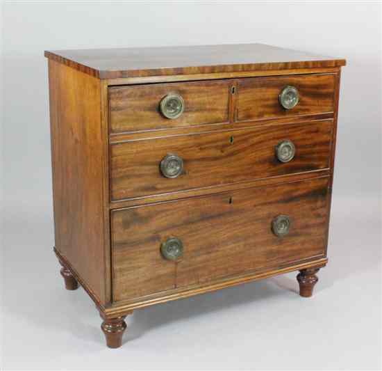 Appraisal: A Regency mahogany chest of two deep drawers on turned