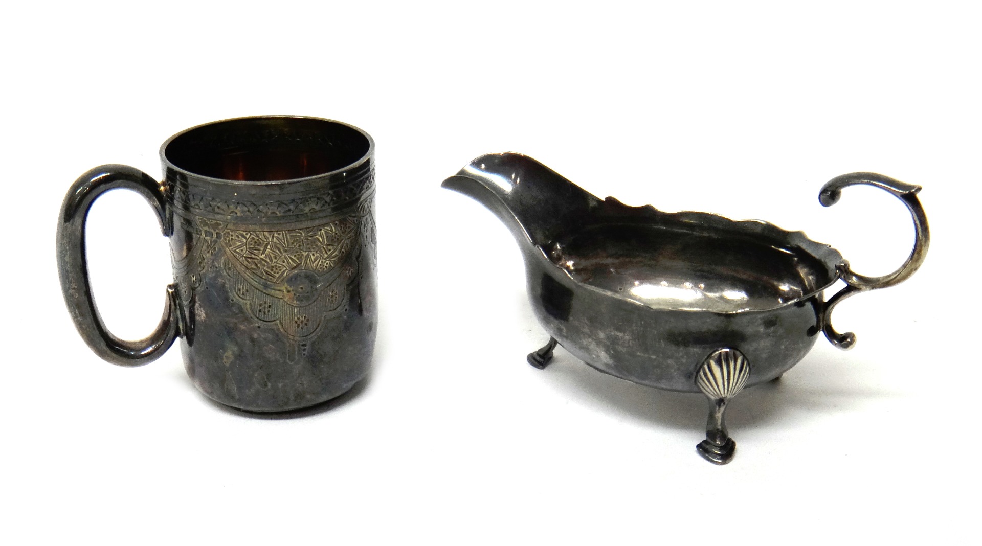 Appraisal: Silver comprising a George III sauceboat with a scrolling handle