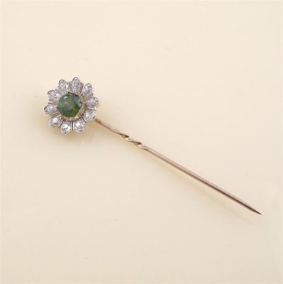 Appraisal: A demantoid garnet and diamond stick pin modelled as a