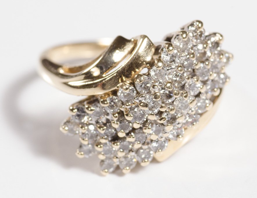 Appraisal: DIAMOND AND FOURTEEN KARAT GOLD CLUSTER RING set with round-cut