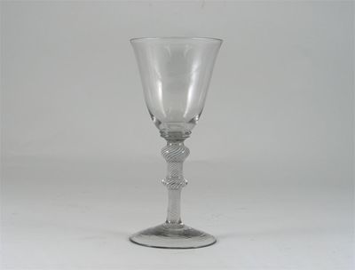 Appraisal: A glass goblet with a bell shaped bowl raised on