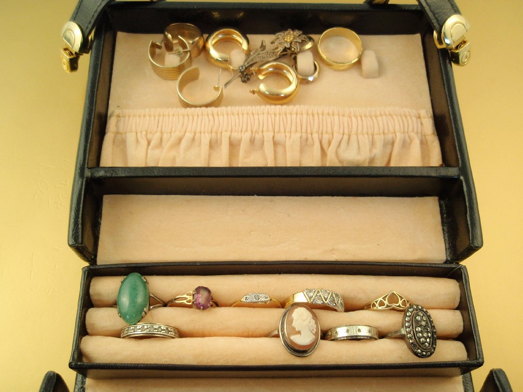 Appraisal: A small black travelling jewellery case and contents of dress