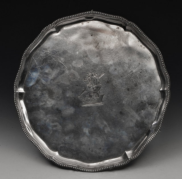 Appraisal: A GEORGE III SILVER SALVER with shaped and gadrooned border