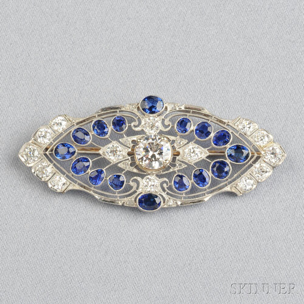 Appraisal: Art Deco Platinum and Sapphire Brooch centering a cubic zirconia