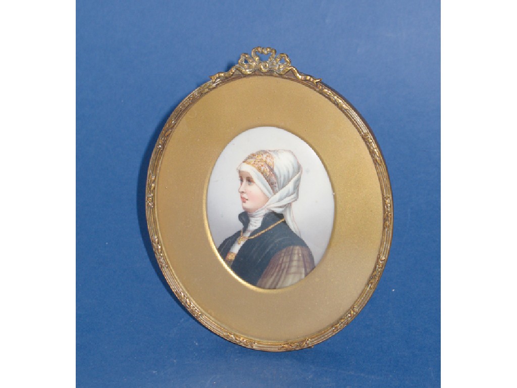 Appraisal: A CONTINENTAL PORCELAIN OVAL PLAQUE painted with the head and