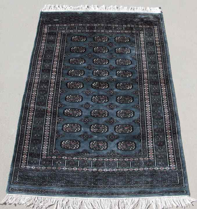 Appraisal: PAKISTANI BOKHARA HAND KNOTTED WOOL RUG ' '' x '