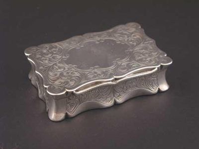 Appraisal: A Victorian engraved snuff box shaped oblong outline with a